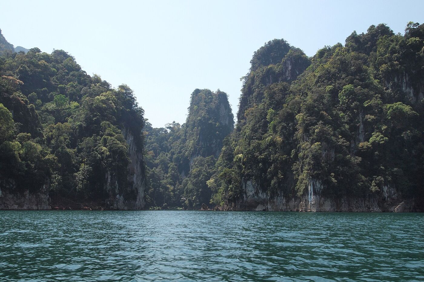 Limestone karst cliffs rising from Cheow Lan Lake, Khao Sok National Park