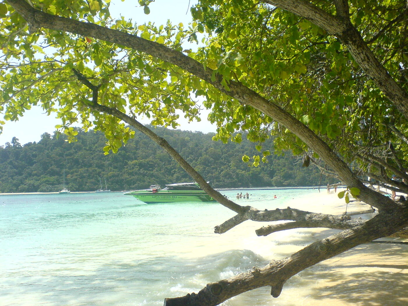 Turquoise shallows and a tour boat at Koh Rok